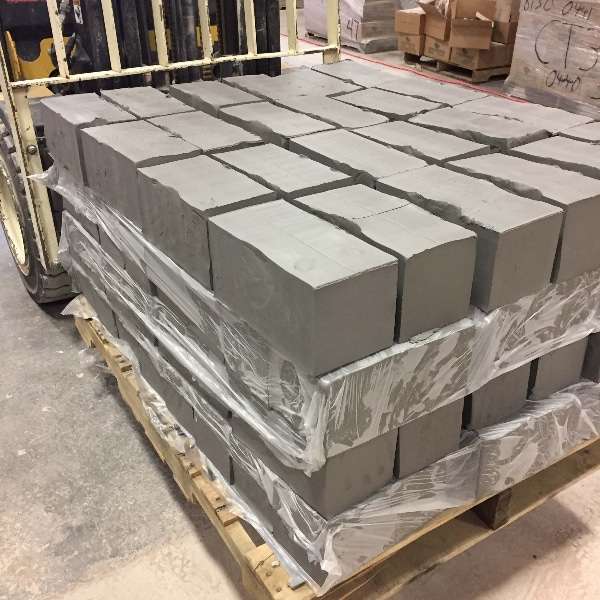 Pallet of gray stoneware clay body blocks ready for pottery, shipping, and bulk orders.